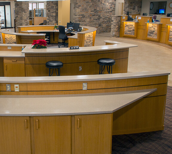 Image of desks, cabinets, and counters designed and installed by Denny's Cabinet Shop for First Security Bank and Trust in Charles City, Iowa.